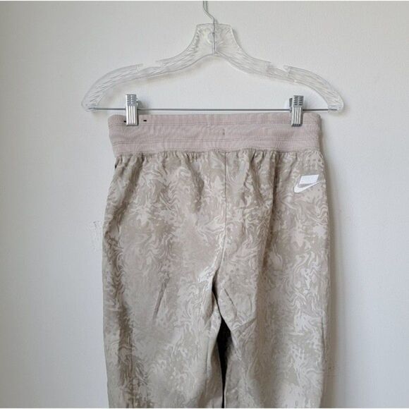 NIKE NSW Jacquard Satin Cuffed Track Pants Cream All Over Print Size XS - Picture 7 of 11